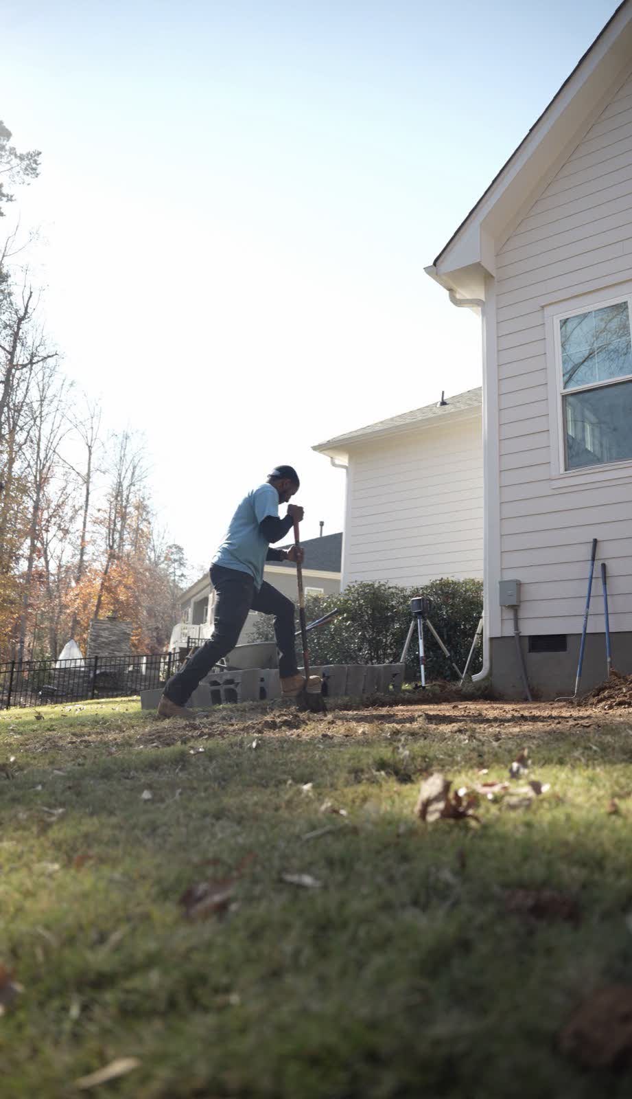 Crew member digging on site