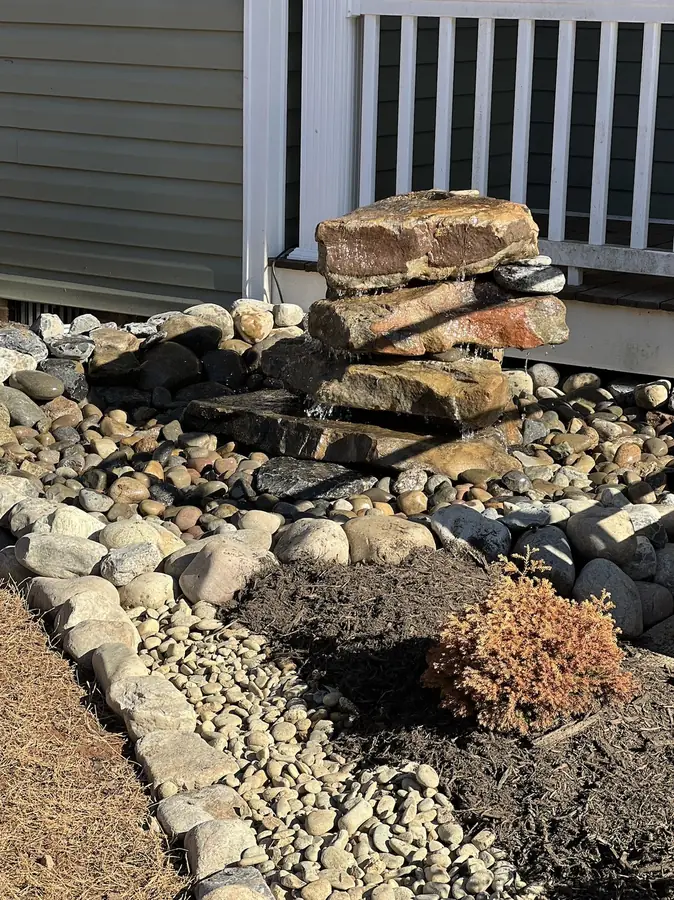 Water feature basin in river rock