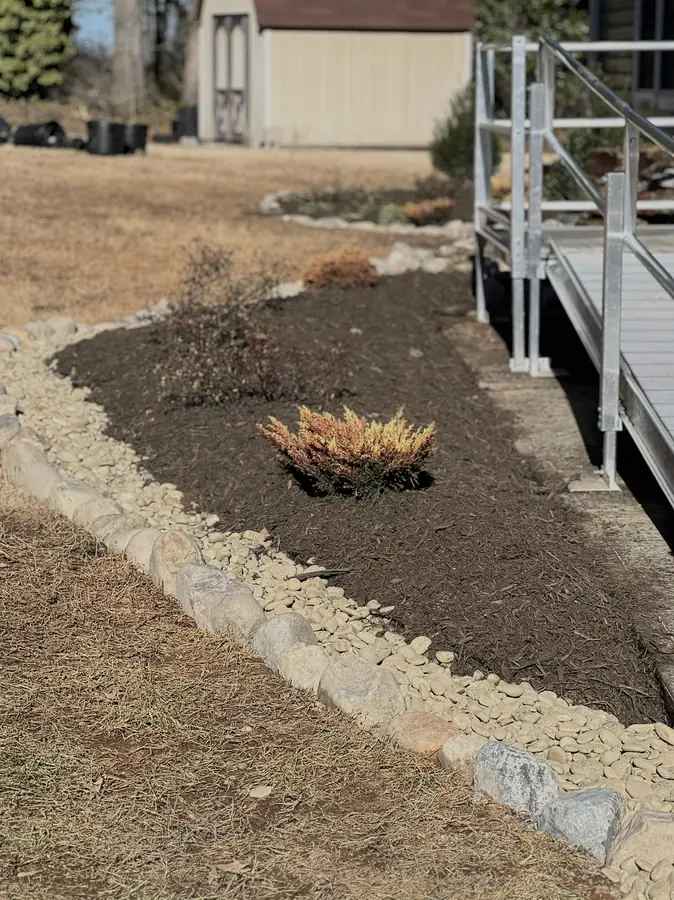 Stone-edged bed on a slope