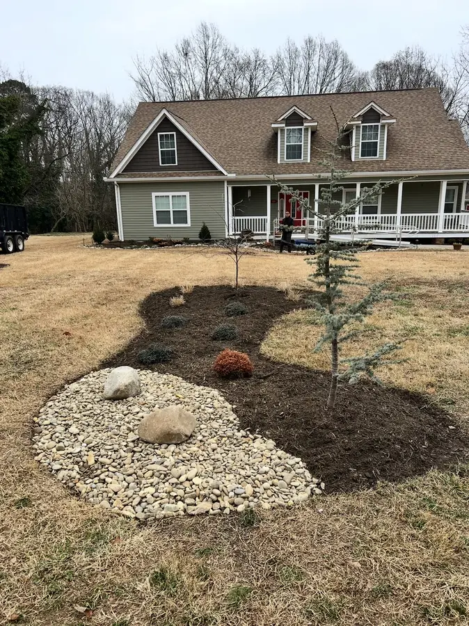 Island bed with boulder accents