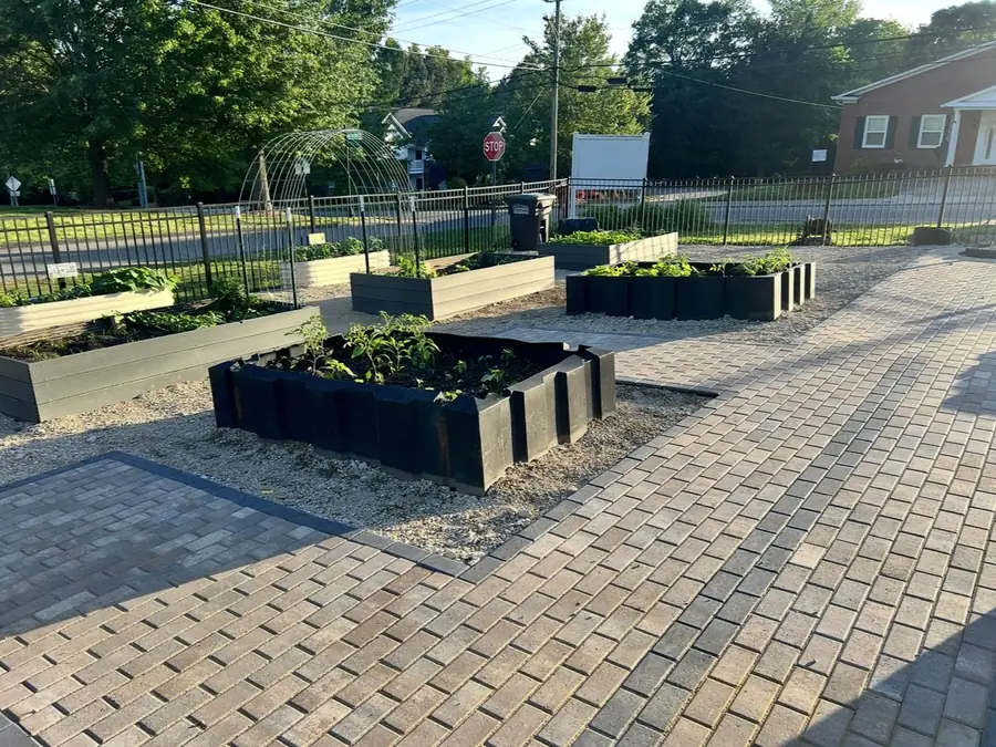 Paver paths between raised garden beds
