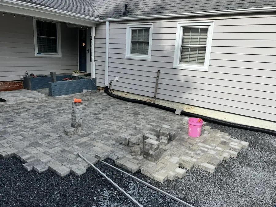 Pavers being laid on a compacted base