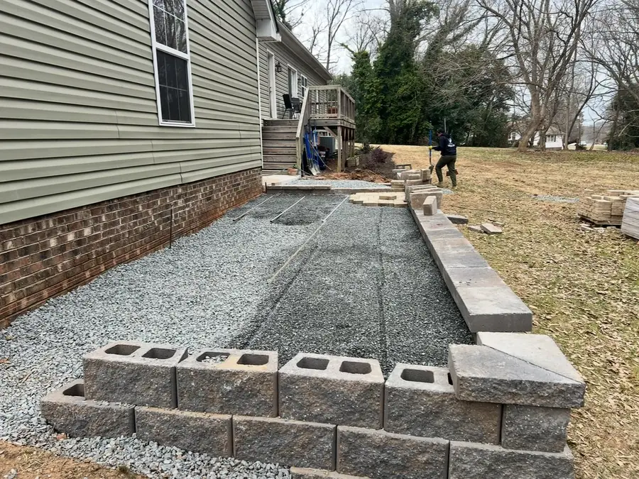 Wall base course on compacted gravel footing