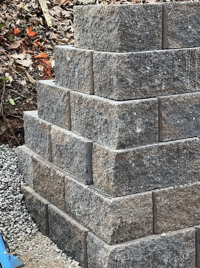 Retaining wall corner blocks set on a gravel base