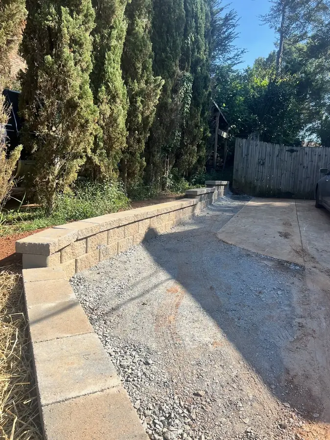 Wall and regraded pad prepped for pavers