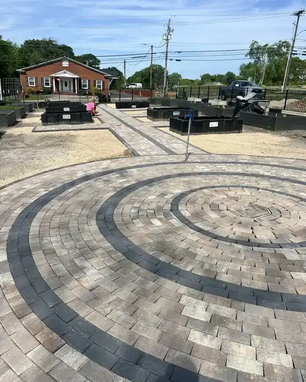 Round paver patio with dark rings