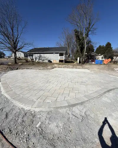 New paver patio with a curved edge